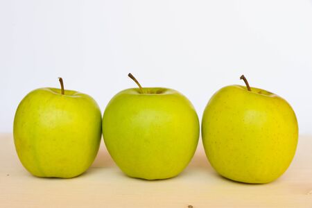 Golden delicious applesの写真素材