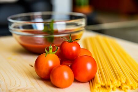 Tomatoes, sauce and spaghettiの写真素材