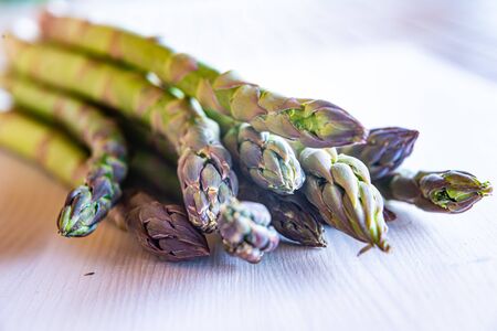 Freshly harvested asparagus, put on a wooden surfaceの写真素材
