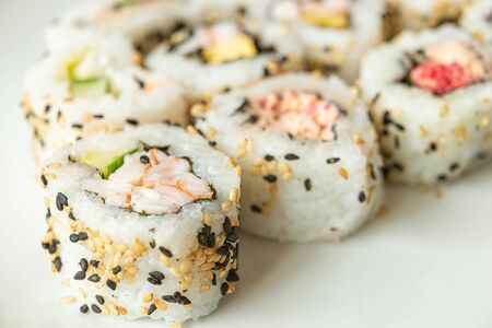 Uramaki on a white plateの写真素材