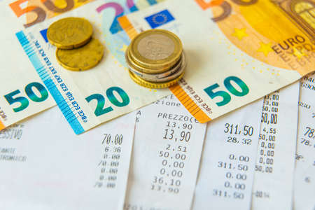 Ordinary living expenses receipts, notes and coins to pay for them; ordinary cost of living.の写真素材