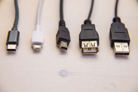Various types of plugs and cables for audio, video, computer, smartphone and recharging connections. Evolution and change of the types of analog and USB connectors.の写真素材