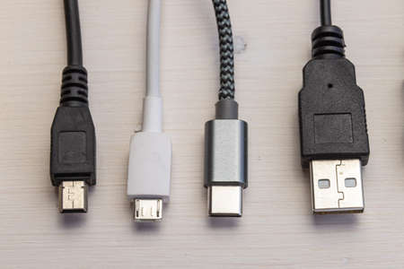 Various types of plugs and cables for audio, video, computer, smartphone and recharging connections. Evolution and change of the types of analog and USB connectors.の写真素材