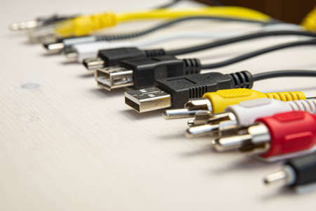 Various types of plugs and cables for audio, video, computer, smartphone and recharging connections. Evolution and change of the types of analog and USB connectors.の写真素材