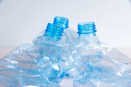 Crushed or crumpled clear plastic bottles. Plastic waste. Plastic recycling. Plastic pollution and waste management.の写真素材