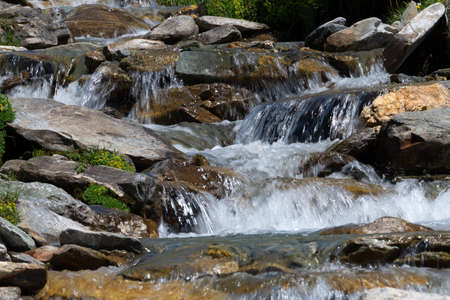 Mountain watercourse. Abundance of water, saving and use of water resources. Contrast of drought.の写真素材