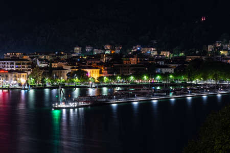 Panorama of the lakefront of Como, and of the outer dam with the Life Electric monument, in a summer evening.の写真素材