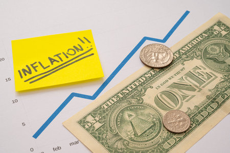 Graph with blue ascending line, dollar bill and coins, and next to it a yellow sheet with the text...