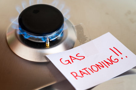 Gas stove, with blank note next to it with the text gas rationing. Rationing and insufficiency in...