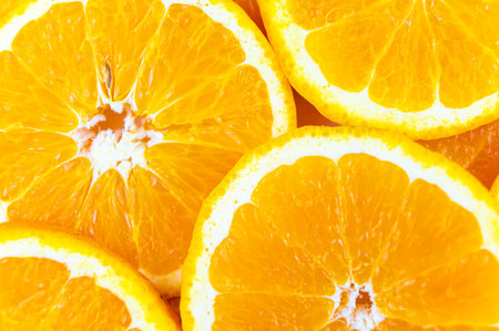 Orange slices close together and on a white background. Orange pulp.の写真素材