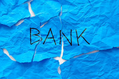 Crumpled paper with word Bank. Failure and collapse of a bank and economic and financial market consequences.の写真素材