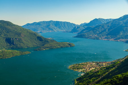 Panorama on the upper lake of Como, with the villages of Gera Lario, Domaso, and the mountains that...
