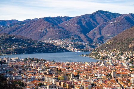 The city of Como, the lake, the lakeside promenade, the buildings, photographed from above.の写真素材
