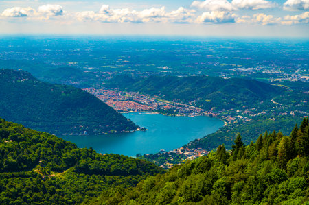 Panorama of Lake Como and the city of Como, the port and the mountains, from Cernobbio, on a summer day.の写真素材