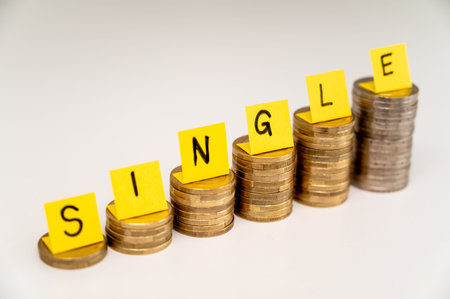 Stacks of coins with text Single. Economic conditions of single people, higher expenses of single...