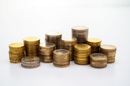 Stack of coins isolated on white background, business and finance concept.