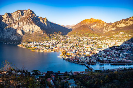 The city of Lecco, shot from above, by day, with the surrounding mountains.の写真素材
