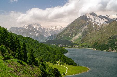 Upper Engadine, Lake Sils, and the village of Maloja, photographed from above in summer.の写真素材
