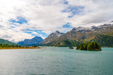 Upper Engadine, Lake Sils, and the village of Isola, photographed from above in summer.
