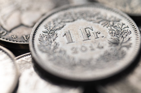 Swiss franc coins. Value of the Swiss Franc and exchange rate trend.の写真素材