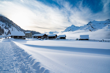 Engadine, Switzerland: Lake Sils Maria, the village of Isola, photographed in winter, with snow and...