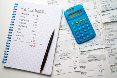 Calculator and notepad with income tax return form on the table