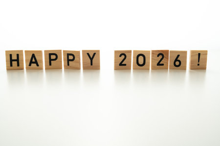Happy new year concept with wooden blocks isolated on white background.の写真素材