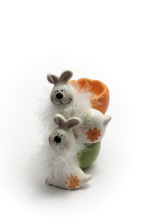 Easter hare yellow egg on white backgroundの写真素材