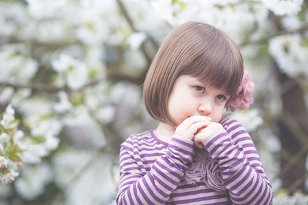 small girl with mother springの写真素材