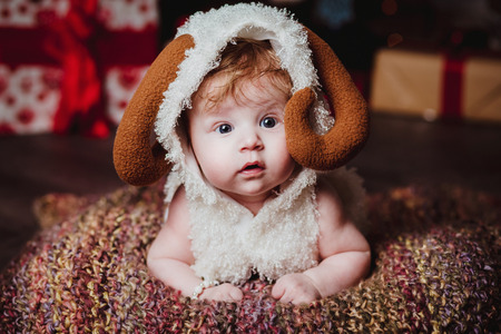 baby boy and christmas treeの写真素材