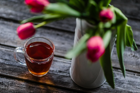 tea and milk on old wood backgroundの写真素材