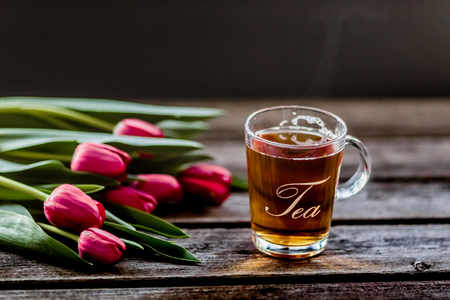 tea and milk on old wood backgroundの写真素材