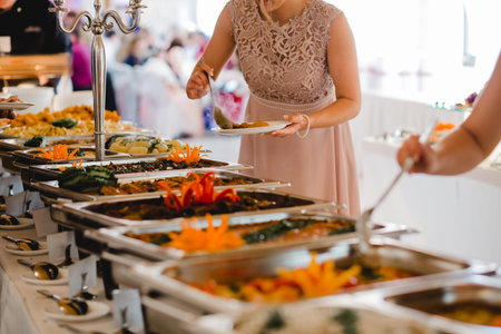Varieties of foods in a wedding buffet cateringの写真素材