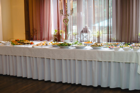 catering wedding buffet with variety of food snacks and appetizers
