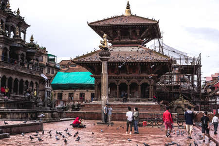 Kathmandu, Nepal - June 29, 2020: temples at Patan Durbar Square after the rain, empty touristic place in pandemic, end of tourism in Nepal, no tourists on famous destination, renovation of complexのeditorial素材