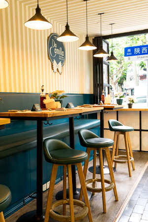 Shanghai - June 13, 2018: Shaanxi Road from the window of a local restaurant in Shanghai, interior design ideas for a simple modern cafe in Italian styleのeditorial素材