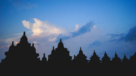 Borobudur Temple in Indonesia, epic cloudy sunset,   soft focus, film grain, travel concept, spirituality and peaceの写真素材