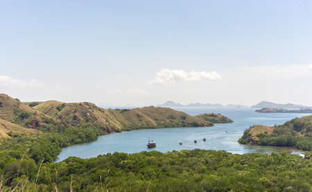 Komodo Island in Indonesia, sea bay, lake and mountains. View of the sea from the mountainの写真素材