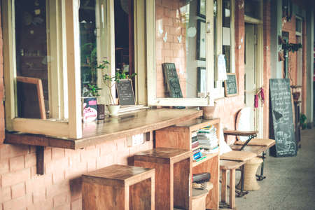 sand dunes and grass on the beach, cold cloudy and windy weather at the seashore, soft focus, beautiful cloudy sunset, dramatic sky and weather, film noiseのeditorial素材