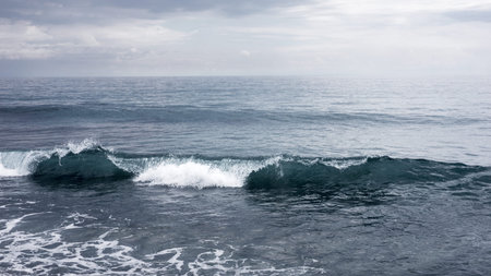 Small waves crashing on the sea, seascape horizon, peaceful and mighty nature, water element,...