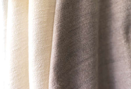 white and brown towel texture. Closeup natural cashmere scarf. brown texture background, close up of a fabricの写真素材