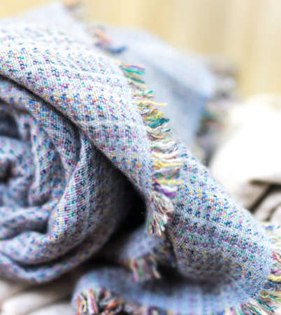 knitting cashmere wool yarn, closeup blue blanket, home decor, Blue tabby cashmere blanket rolled up, selective focusの写真素材