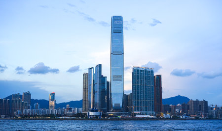 Hong Kong - June 25, 2016: skyline view in Hong Kong at sunset, IFC building, blue sky, modern architecture, illustrative editorialのeditorial素材