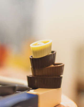 close up of dark milk and white chocolate candies on the box, delicious homemade sweets,の写真素材