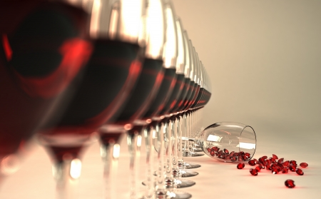 Row of red wine glasses, with one of them felt down on floor, with many ruby stones coming out of itの写真素材