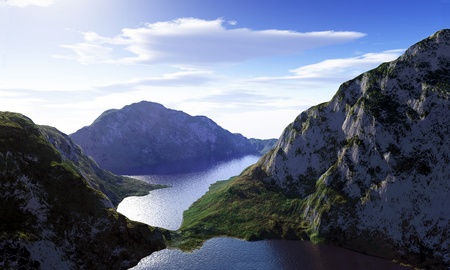 Mountains and lake landscape, viewed from bird eye, with blue sky and fluffy clouds.の写真素材