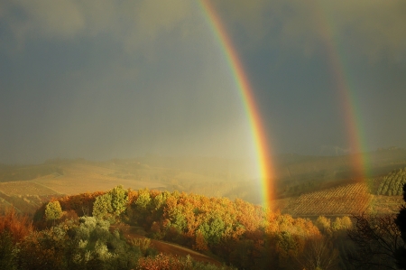 Double rainbow on a beautiful hills scenery in Tuscany,  Italy の写真素材