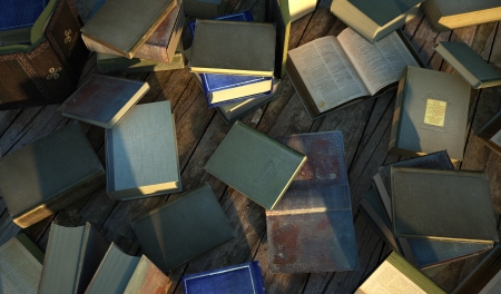 Many old and ancient books, spread over a wooden surface の写真素材