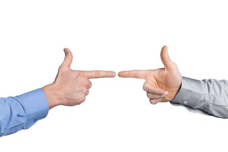 Close-up of two businessman's hands, pointing like a gun in front of each other. Isolated onの写真素材