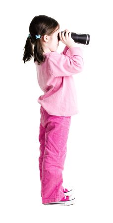 Young girl looking out through binoculars on a white backgroundの写真素材